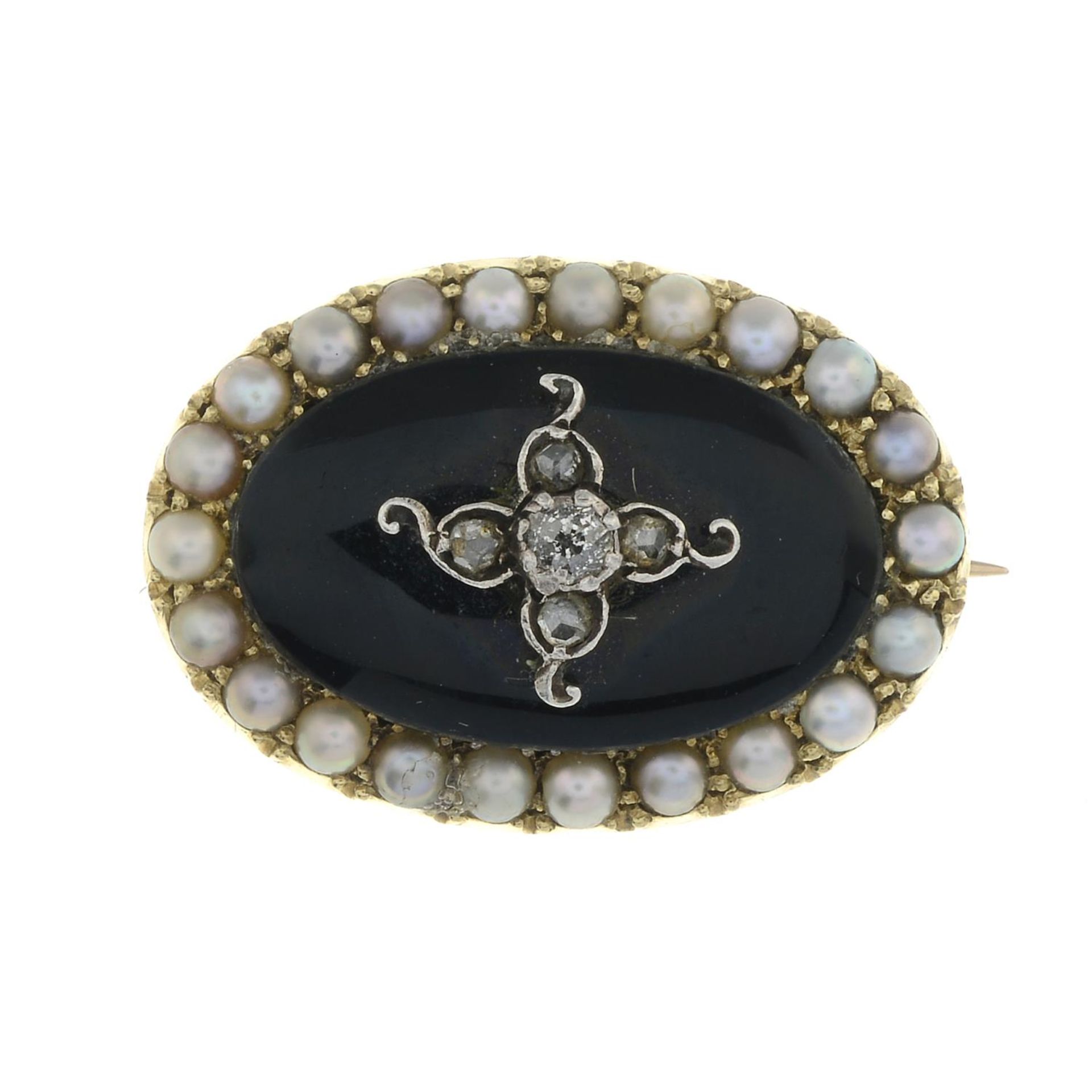 A late 19th century gold diamond, onyx and split pearl mourning brooch.Length 2.2cms.