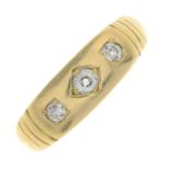 A late Victorian18ct gold diamond three-stone ring.Estimated total diamond weight 0.15ct,