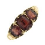 A garnet three-stone ring,