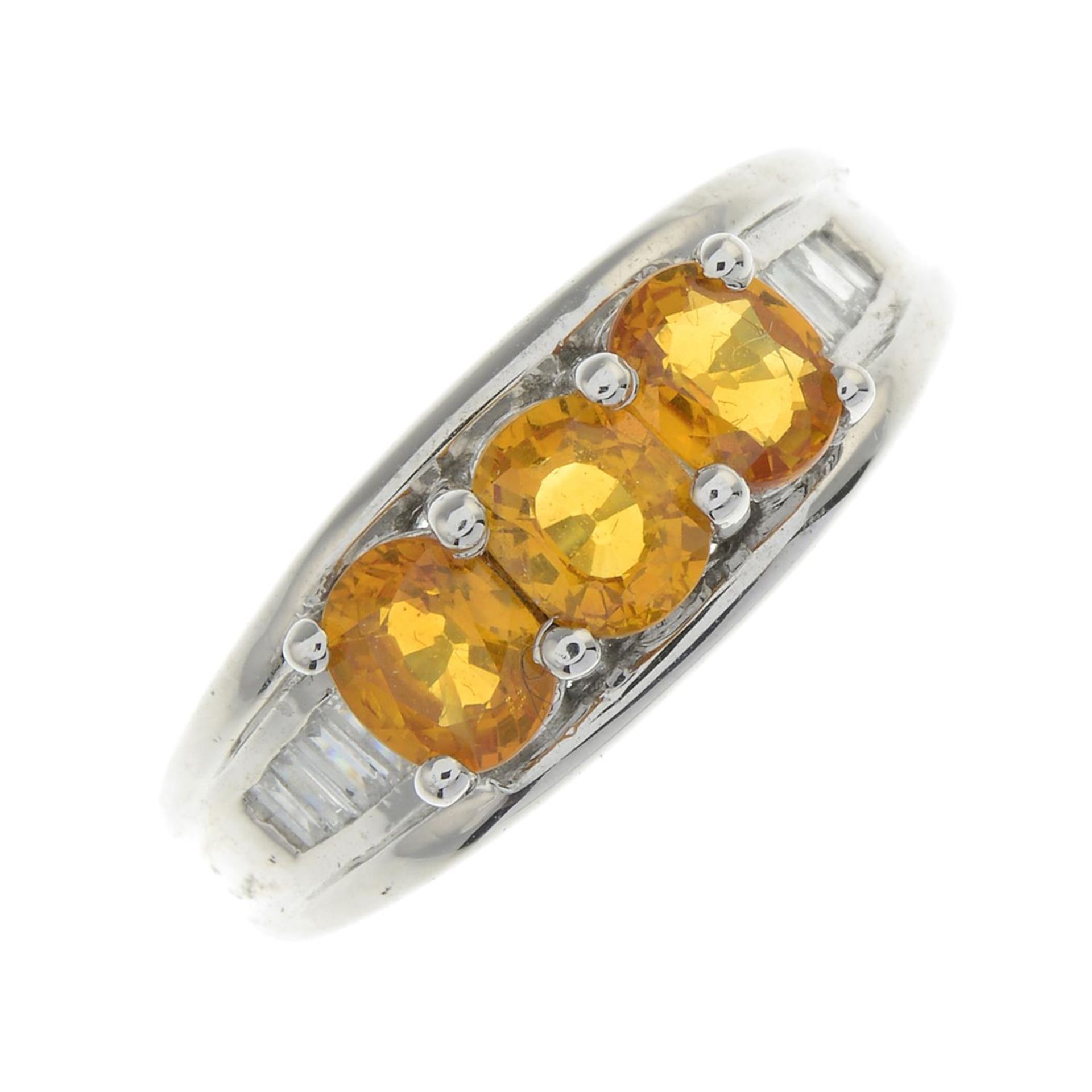 An 18ct gold yellow sapphire and diamond ring.Total sapphire weight 1.45cts,