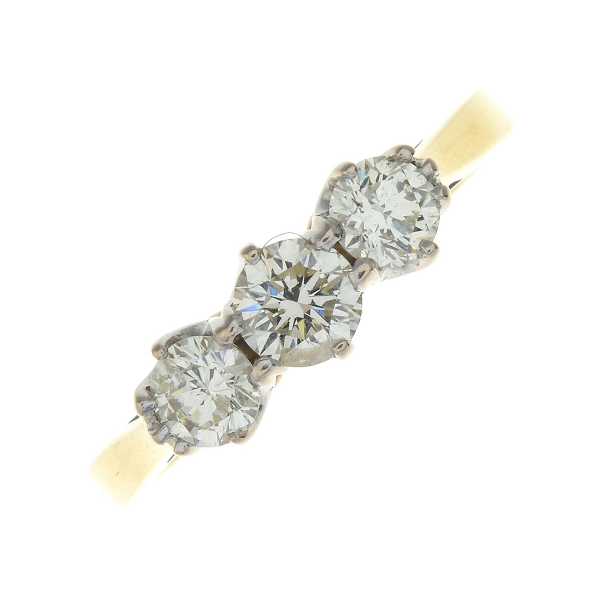 An 18ct gold diamond three-stone ring.