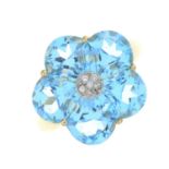 A 9ct gold blue topaz and diamond floral dress ring.
