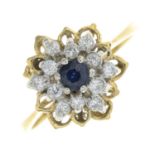 A sapphire and diamond cluster ring.Estimated total diamond weight 0.25ct.Stamped 18ct.Ring size P.