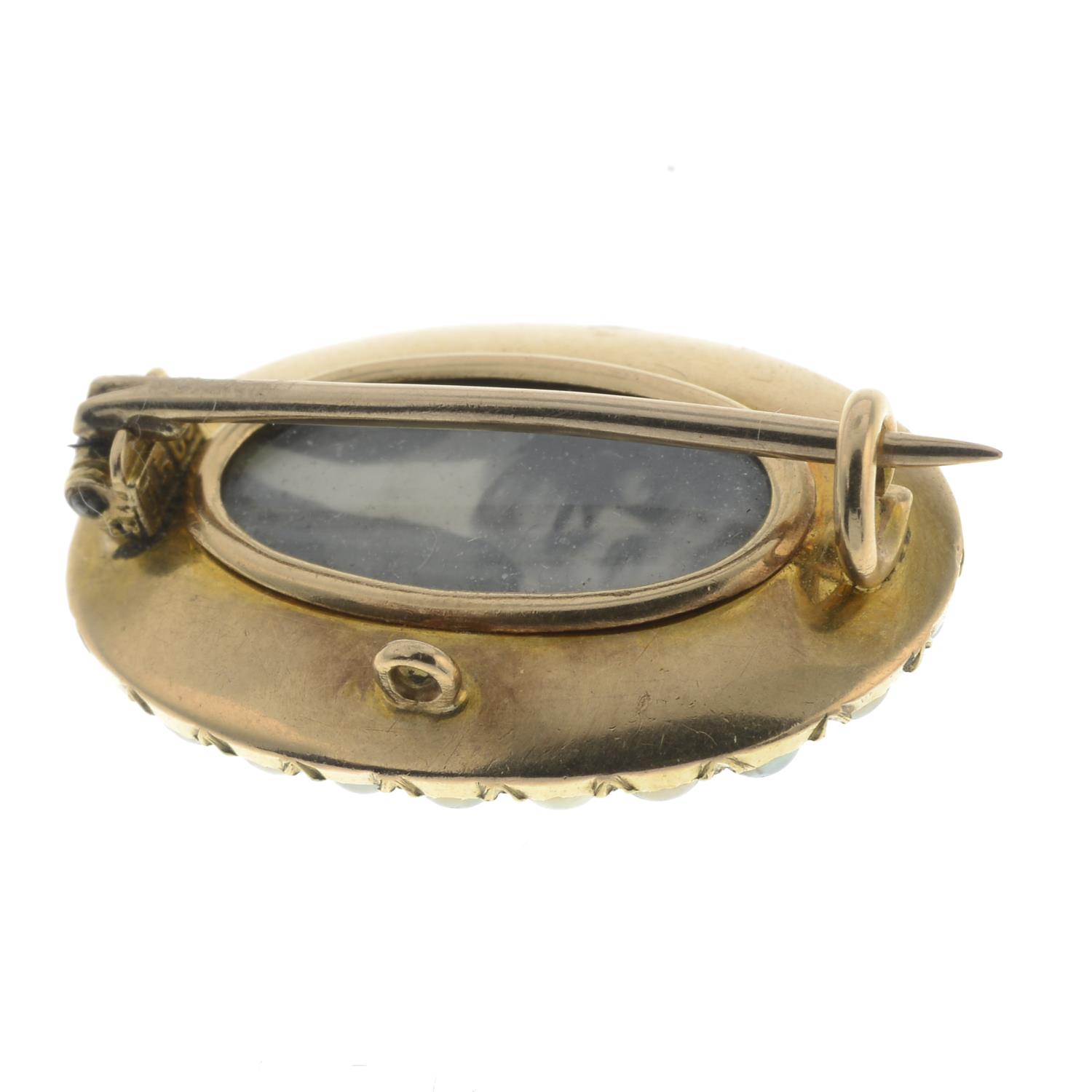 A late 19th century gold diamond, onyx and split pearl mourning brooch.Length 2.2cms. - Image 2 of 2