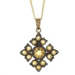 A citrine quatrefoil pendant, with 9ct gold chain.Chain with hallmarks for 9ct gold.