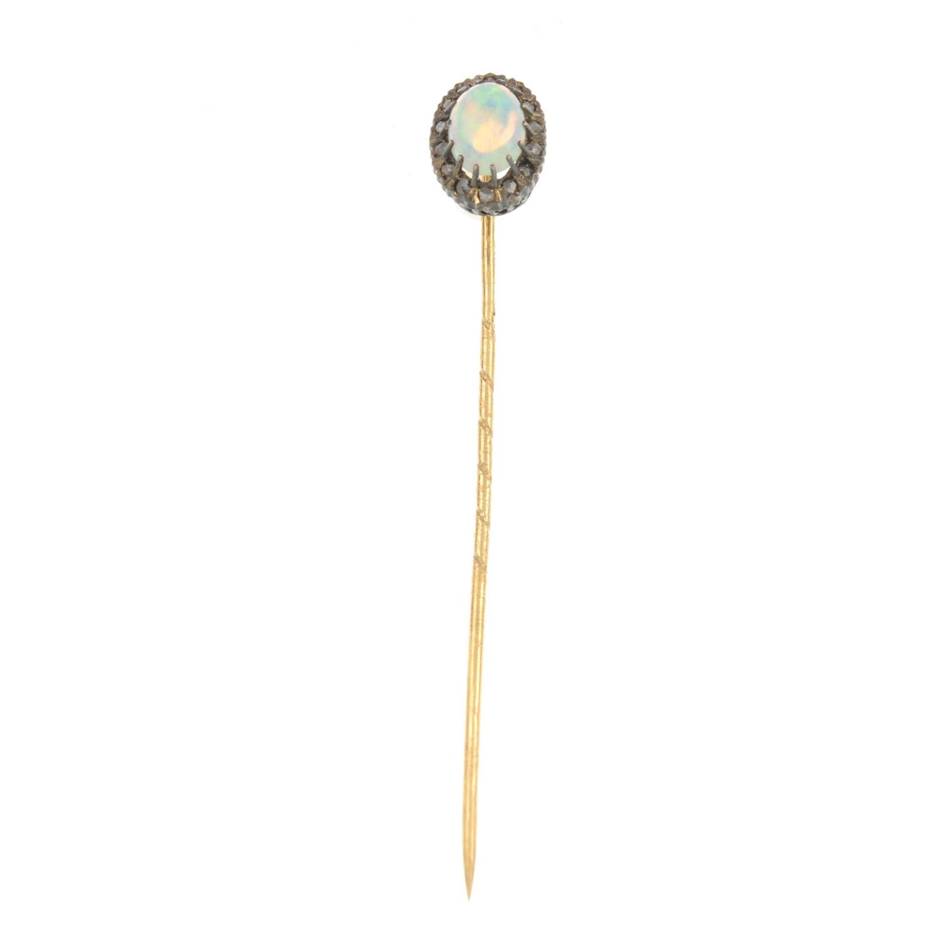 An opal and diamond cluster stickpin.Pin with maker's marks for C G Hallberg. - Image 2 of 3