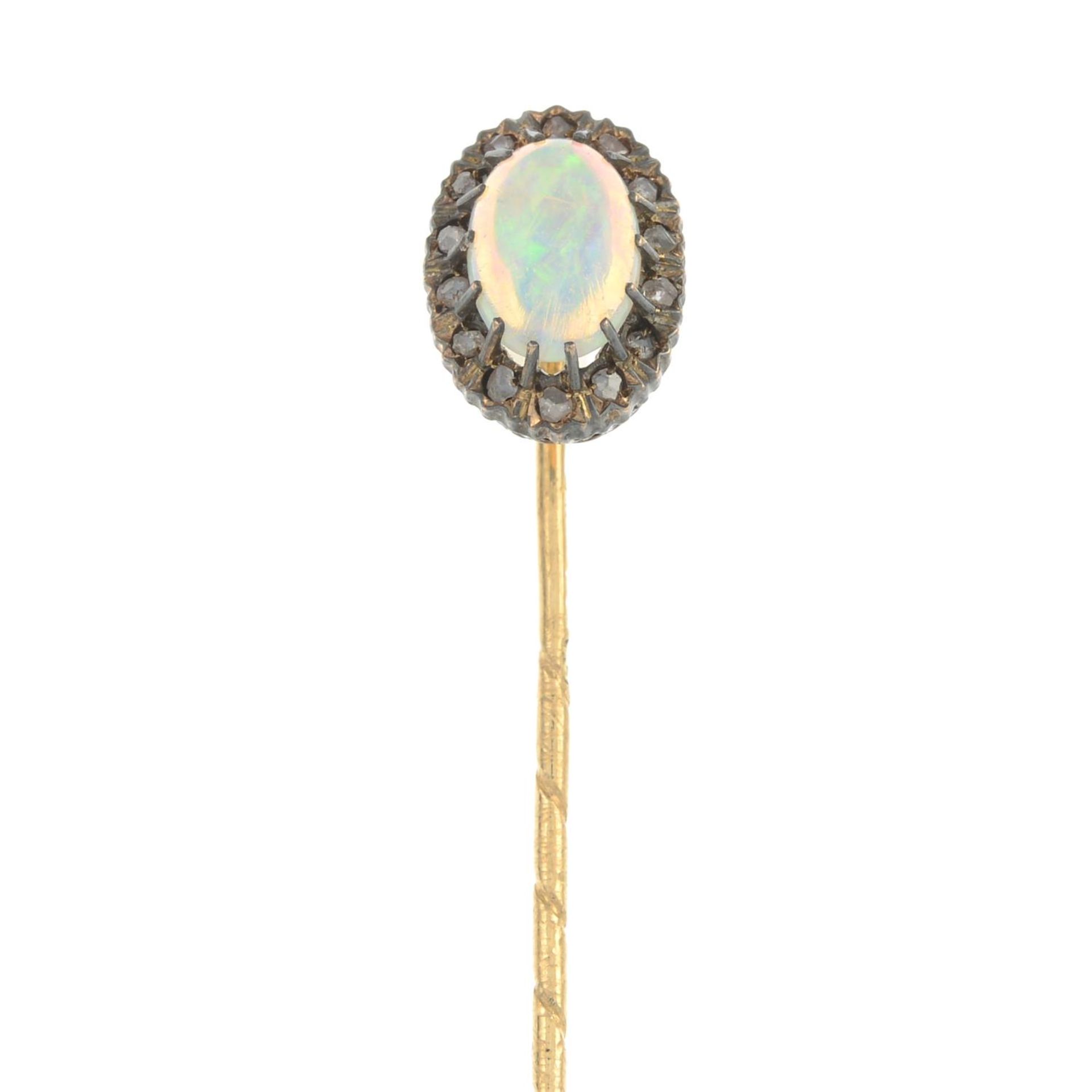 An opal and diamond cluster stickpin.Pin with maker's marks for C G Hallberg.