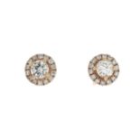 A pair of 18ct gold diamond earrings.