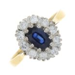 An 18ct gold sapphire and diamond cluster ring.Estimated total diamond weight 0.40ct,
