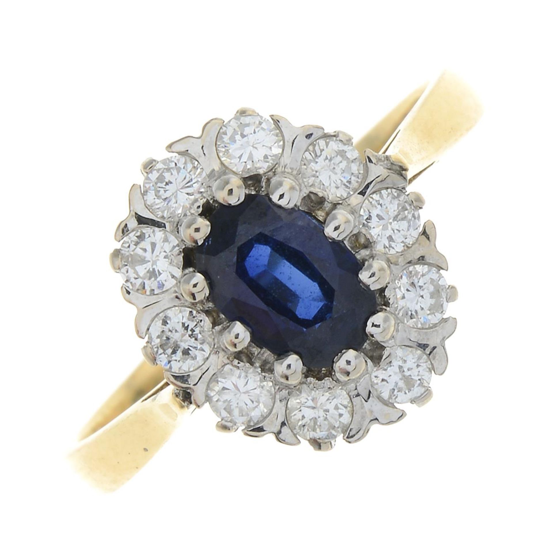 An 18ct gold sapphire and diamond cluster ring.Estimated total diamond weight 0.40ct,