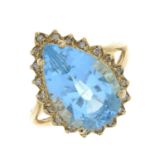 A blue topaz and diamond cluster ring.