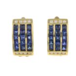 A pair of sapphire and diamond earrings.Estimated total diamond weight 0.15ct.Stamped 750.Length
