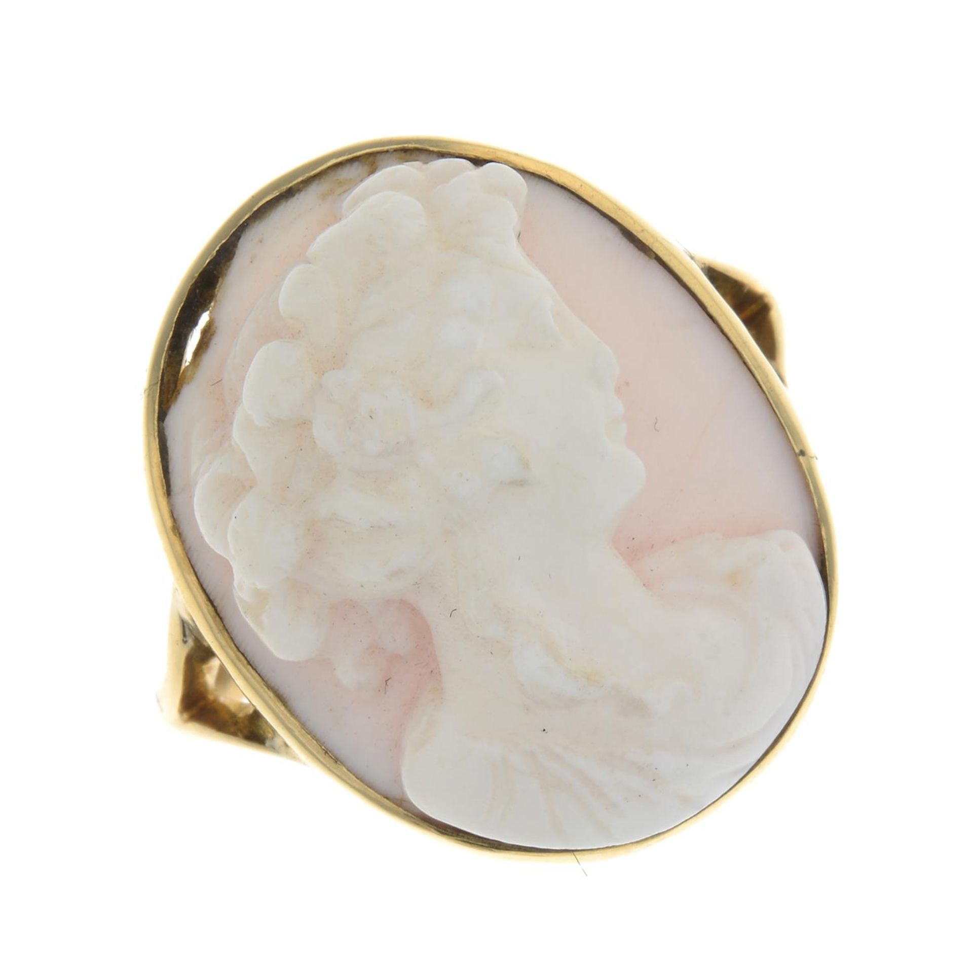 A conch shell cameo ring, carved to depict a lady in profile.