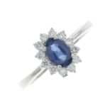 An 18ct gold sapphire and diamond cluster ring.