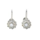 A pair of diamond earrings.Estimated total diamond weight 0.30ct,