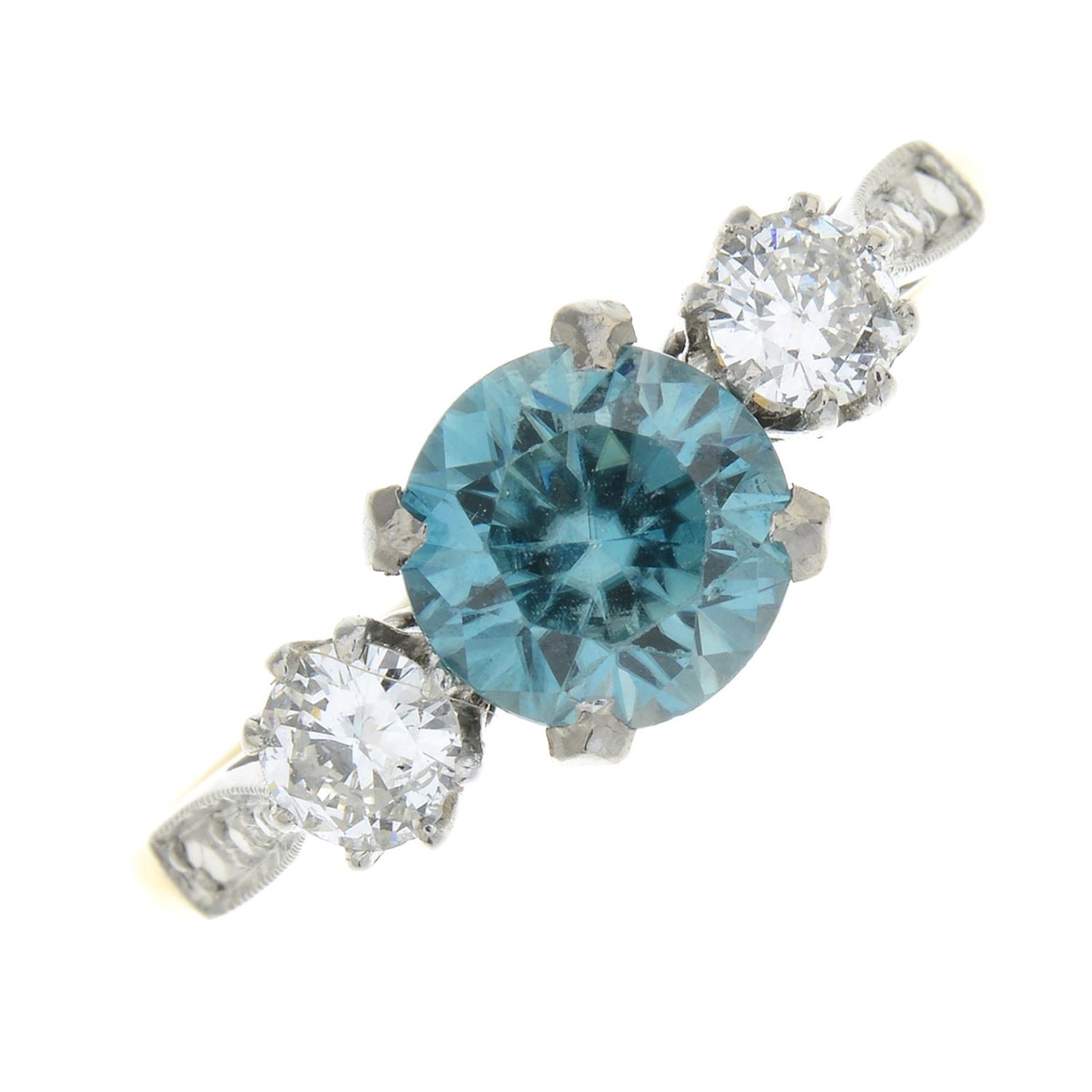 A blue zircon and diamond three-stone ring.