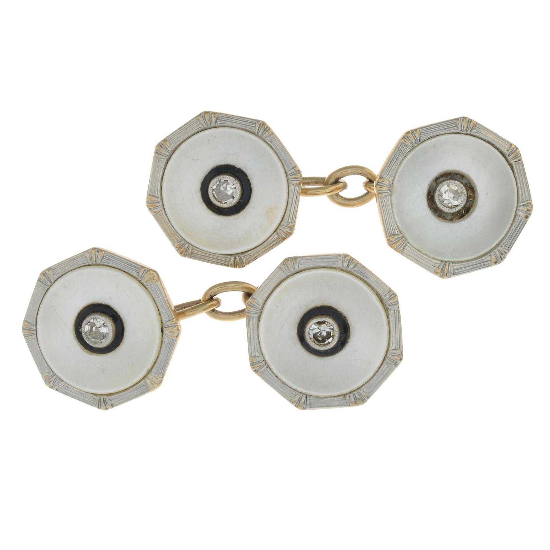 A pair of mid 20th century diamond and mother-of-pearl cufflinks.Estimated total diamond weight