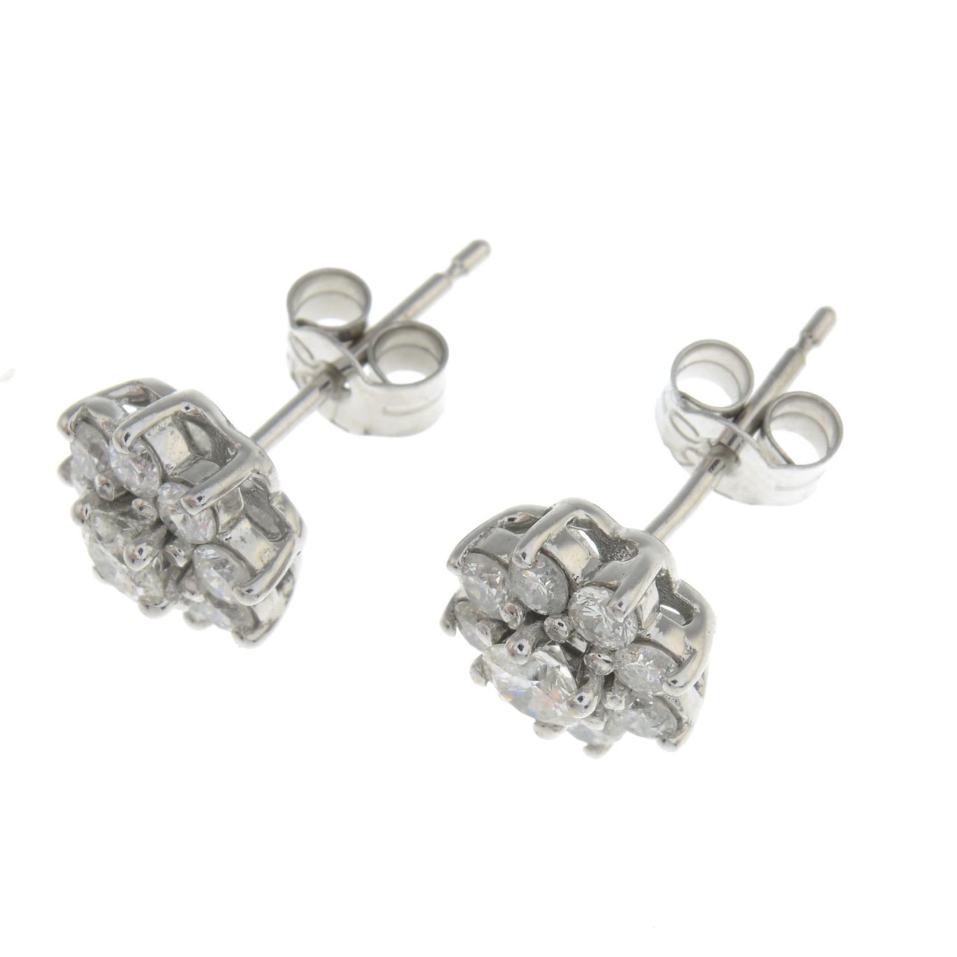 A pair of diamond floral cluster earrings.Estimated total diamond weight 1ct, - Bild 2 aus 2