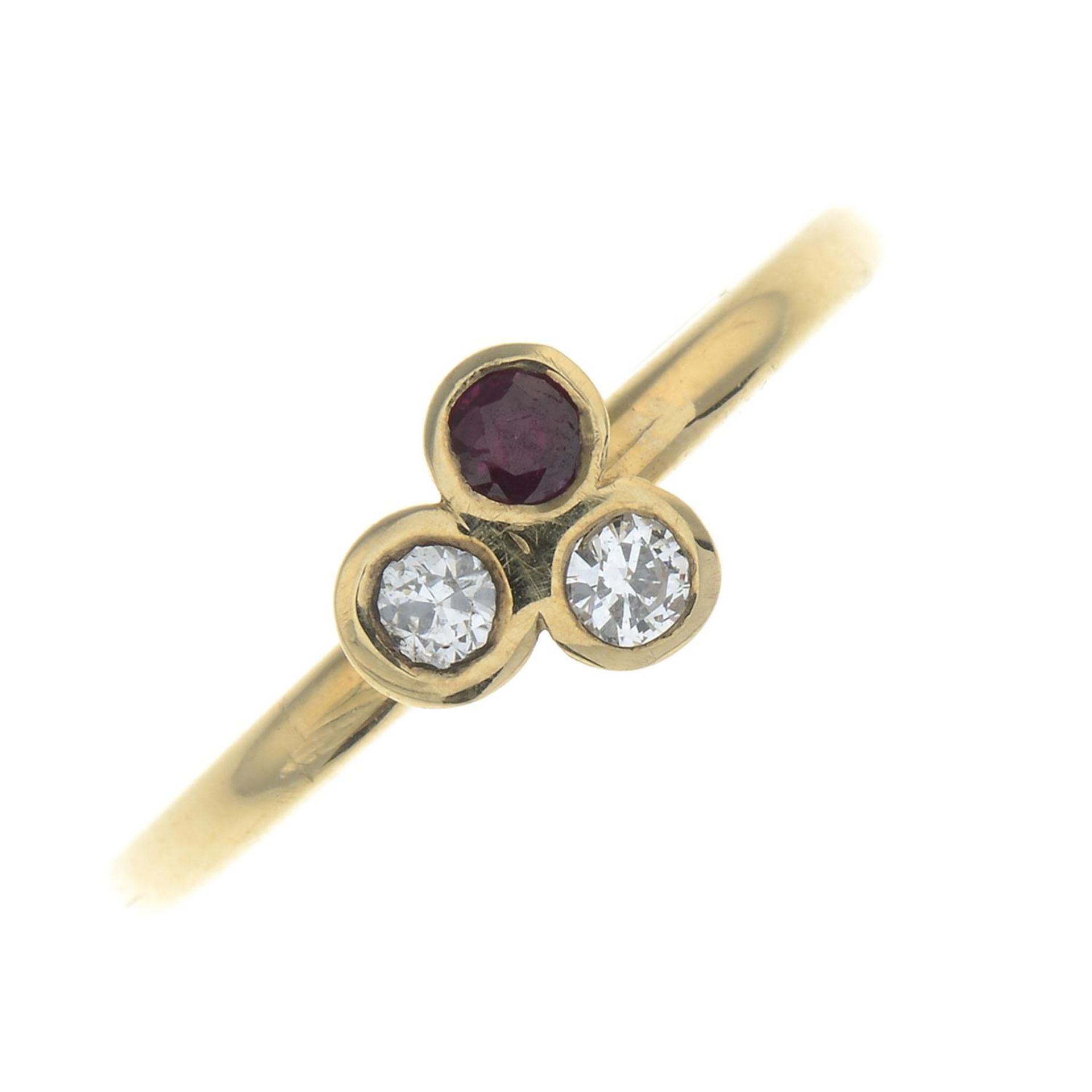 A 9ct gold ruby and diamond trefoil ring.
