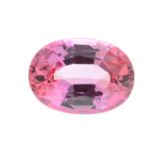 An oval-shape pink sapphire.