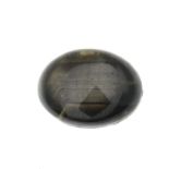 An oval black sapphire cabochon.