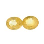 Two oval-shape yellow sapphires.