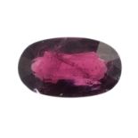 An oval-shape natural red spinel.