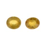 Two oval-shape yellow sapphires.