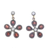 A pair of garnet and diamond floral cluster earrings.Estimated total diamond weight 0.10ct.