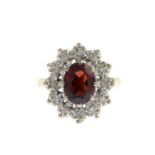 An 18ct gold garnet and diamond cluster ring.