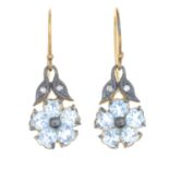 A pair of blue topaz and diamond floral earrings.Length 2.8cms.