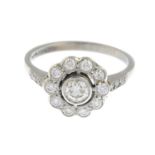 A brilliant-cut diamond floral cluster ring.Total diamond weight 0.70ct,