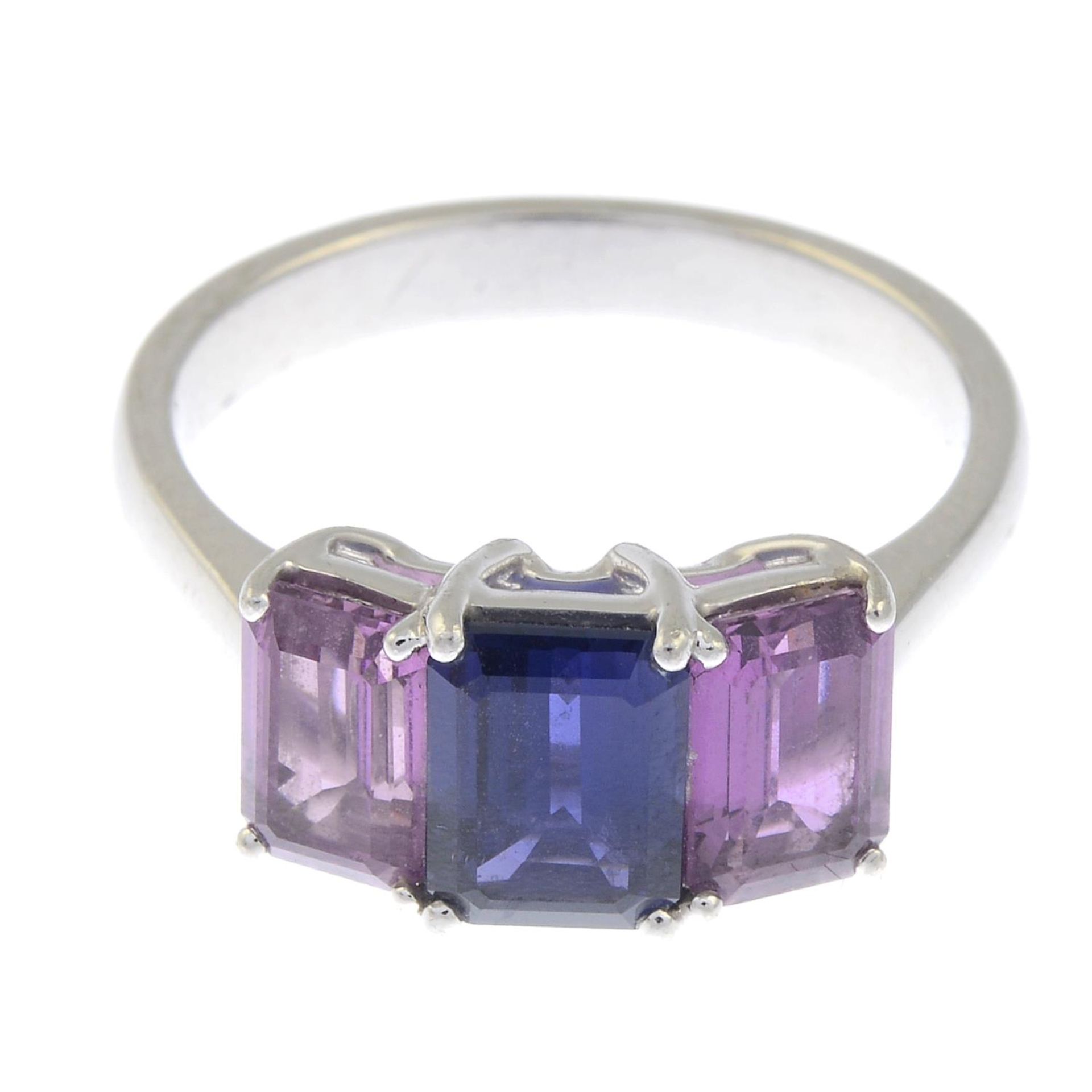 A sapphire and pink sapphire three-stone ring.