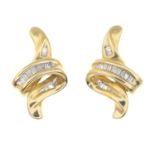 A pair of diamond earrings.Estimated total diamond weight 0.10ct.