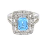 A blue topaz and brilliant-cut diamond cluster ring.Estimated total diamond weight 0.80ct.Stamped