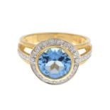 A 9ct gold blue topaz and diamond dress ring.Estimated total diamond weight 0.20ct.