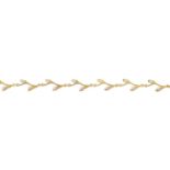 A seed pearl foliate bracelet.Stamped 14K.