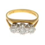 An 18ct gold diamond three-stone ring.Estimated total diamond weight 0.25ct.