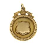 A 9ct gold medallion.Hallmarks for 9ct gold.