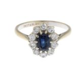 A sapphire and diamond cluster ring.Estimated total diamond weight 0.40ct.