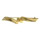 A '1987' ribbon brooch, by Tiffany & Co.Signed 1987, Tiffany & Co.Length 5.7cms.