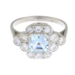 An aquamarine and old-cut diamond cluster ring.Aquamarine weight 0.90ct.Total diamond weight