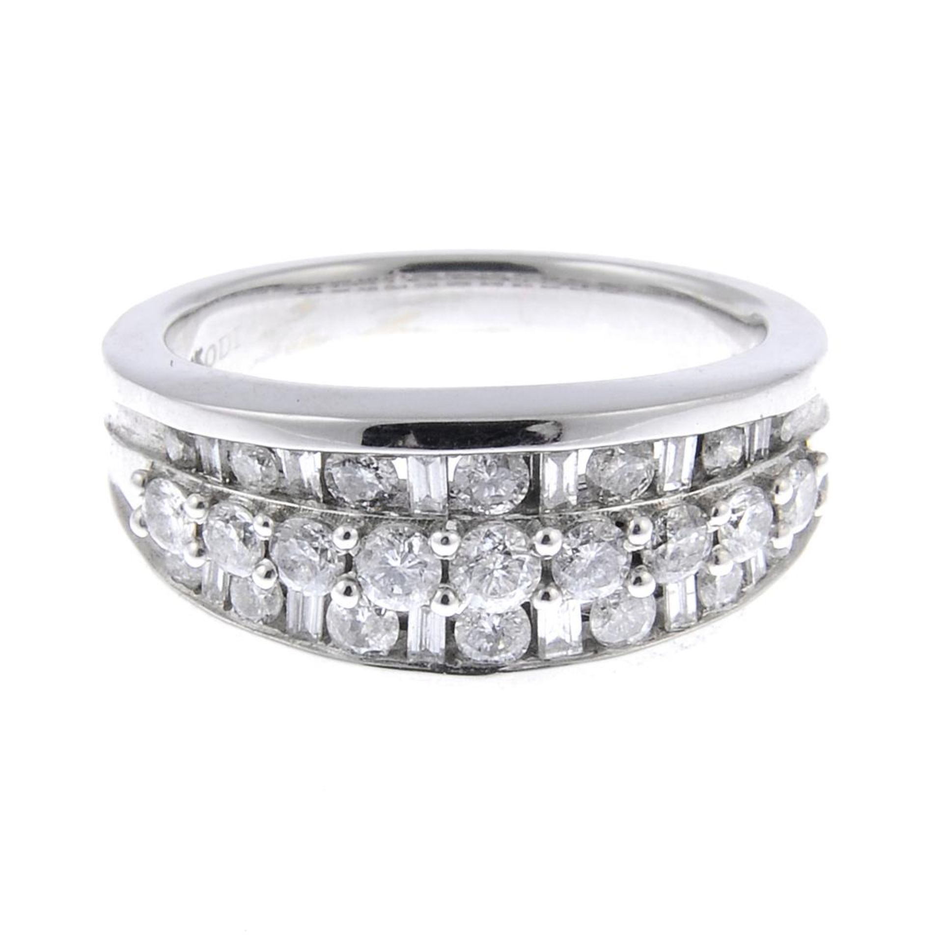 A brilliant and baguette-cut diamond dress ring.