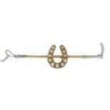 An early 20th century 9ct gold and silver riding crop brooch,