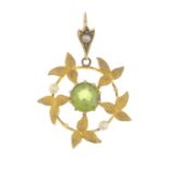 A peridot and seed pearl wreath pendant.Three seed pearls deficient.