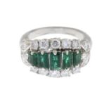 An emerald and brilliant-cut diamond dress ring.Estimated total diamond weight 0.80ct.Ring size I.