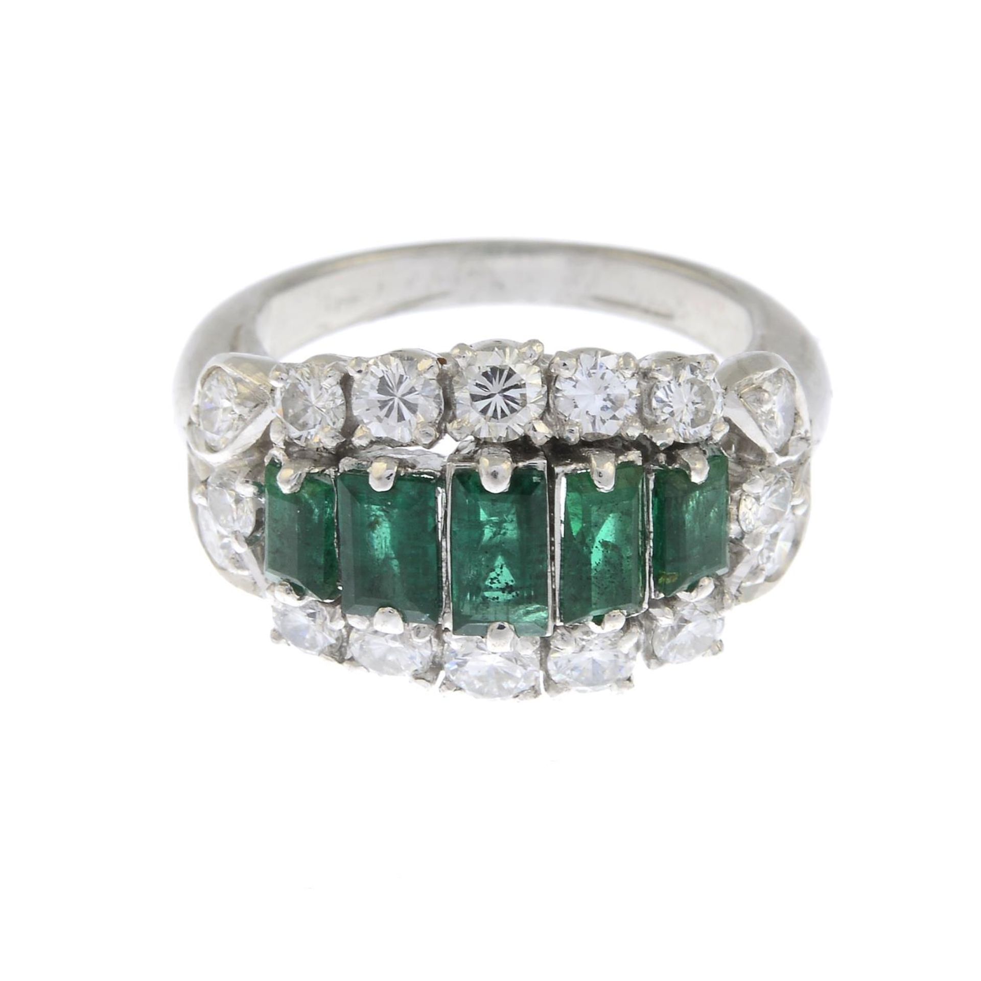 An emerald and brilliant-cut diamond dress ring.Estimated total diamond weight 0.80ct.Ring size I.