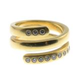 An 18ct gold brilliant-cut diamond spiral ring.Estimated total diamond weight 0.30ct,