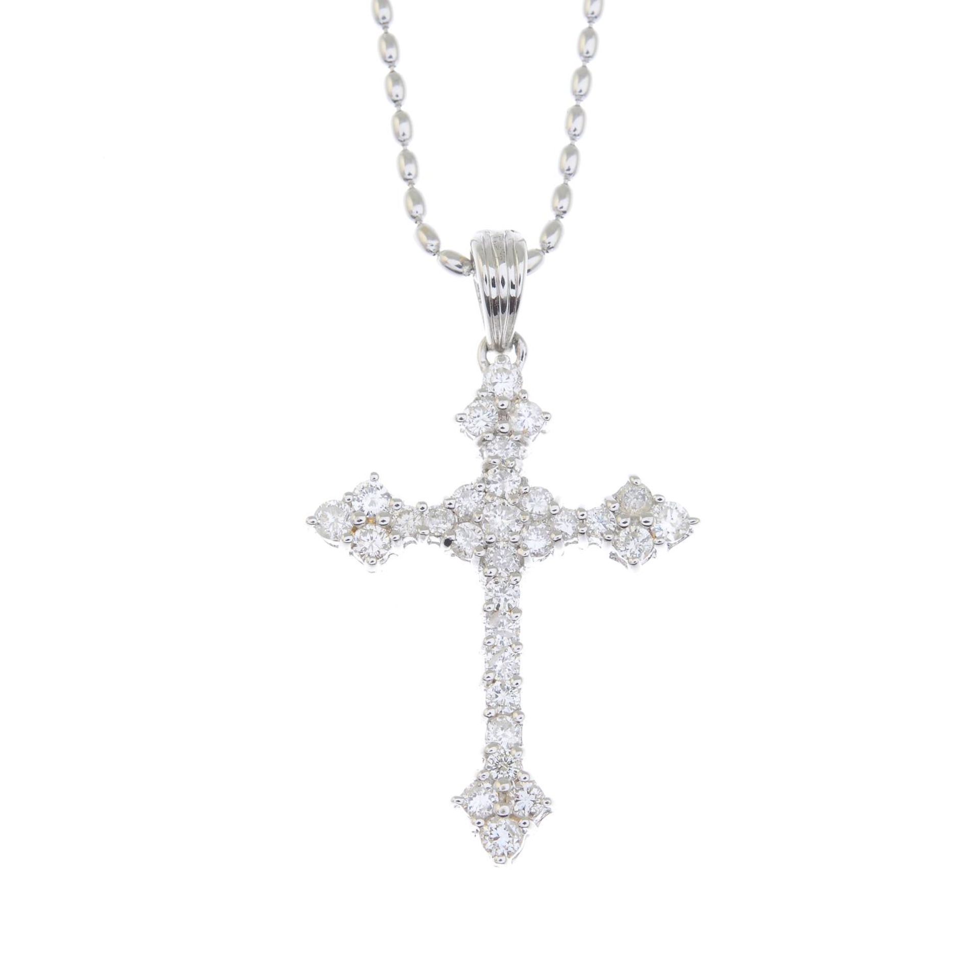 A brilliant-cut diamond cross pendant,