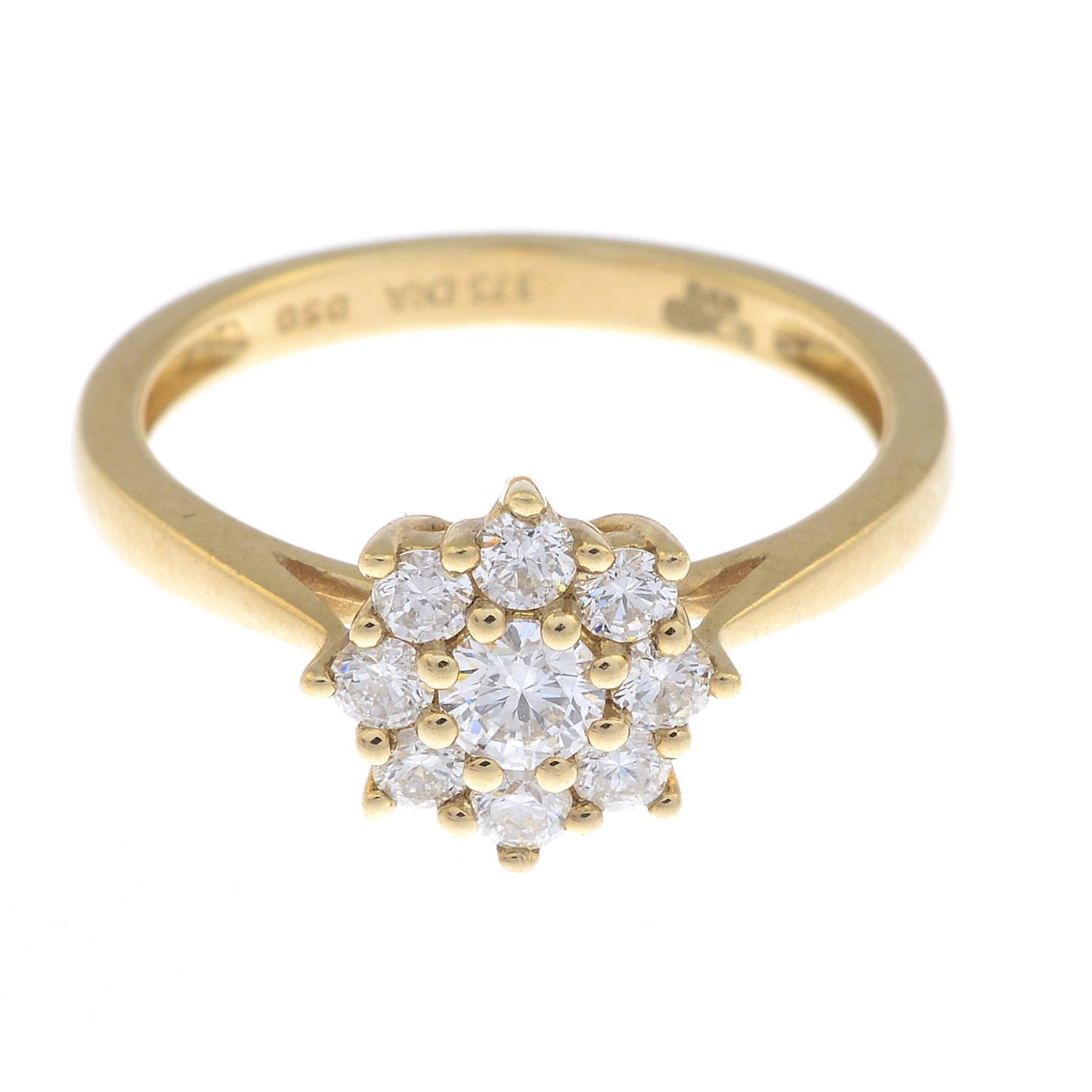 A 9ct gold diamond floral cluster ring.Total diamond weight 0.50ct, stamped to band.